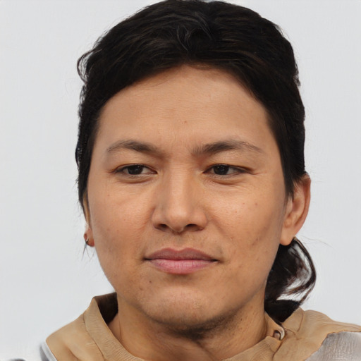 Joyful asian adult male with short  brown hair and brown eyes