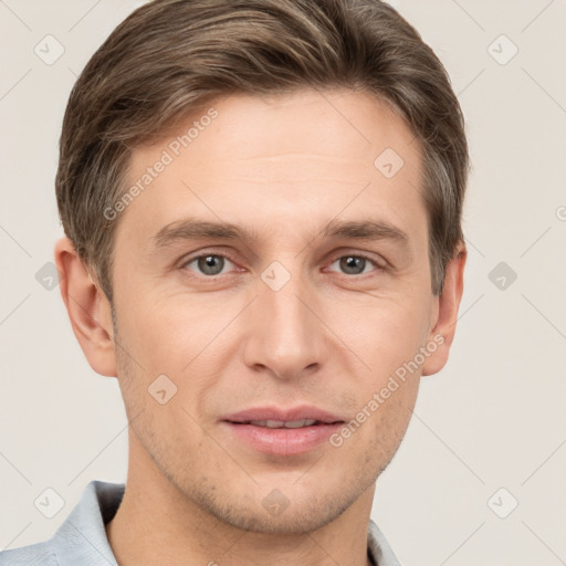 Joyful white adult male with short  brown hair and grey eyes