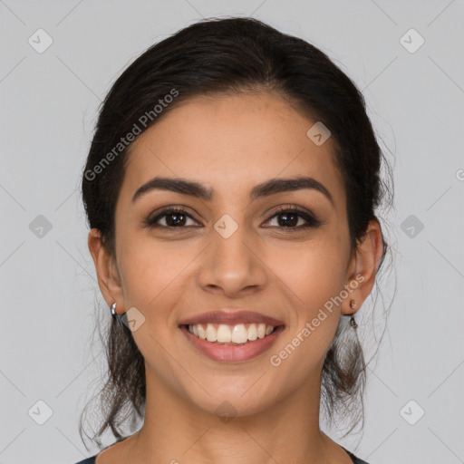 Joyful latino young-adult female with medium  brown hair and brown eyes