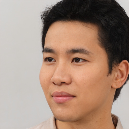 Neutral asian young-adult male with short  black hair and brown eyes