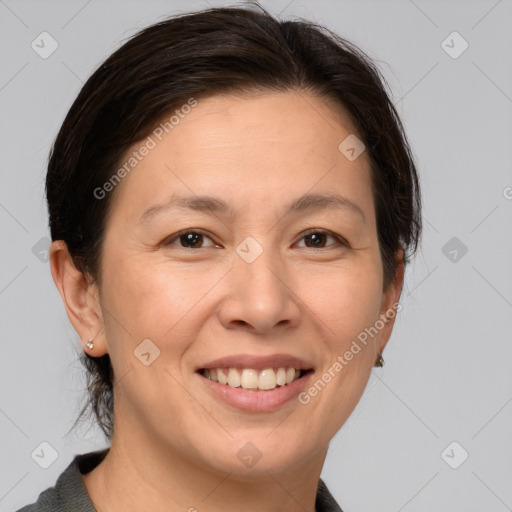 Joyful white adult female with medium  brown hair and brown eyes