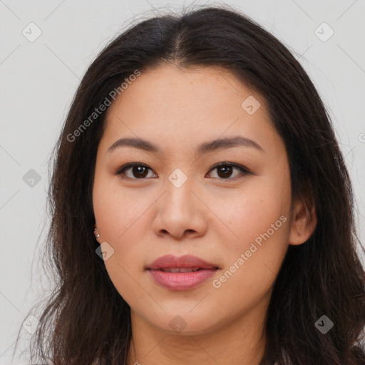 Joyful asian young-adult female with long  brown hair and brown eyes