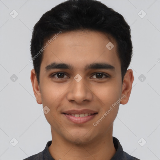 Joyful latino young-adult male with short  black hair and brown eyes