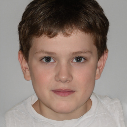 Joyful white child male with short  brown hair and brown eyes