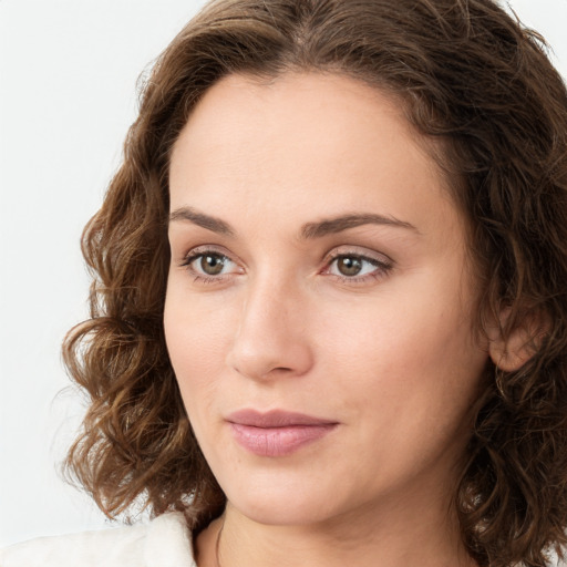 Neutral white young-adult female with medium  brown hair and green eyes