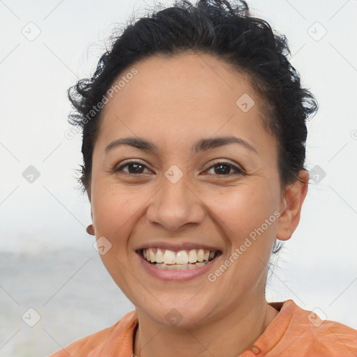 Joyful latino young-adult female with short  brown hair and brown eyes