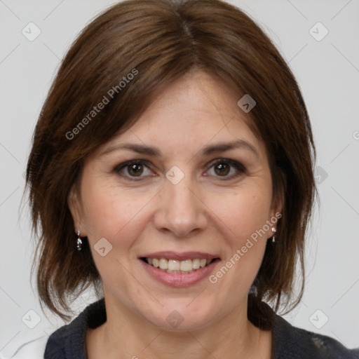 Joyful white adult female with medium  brown hair and grey eyes