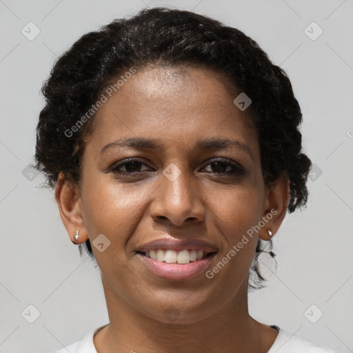 Joyful black young-adult female with short  brown hair and brown eyes