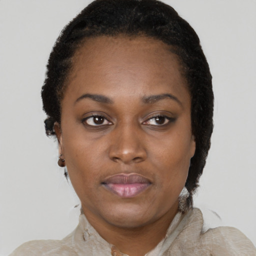 Neutral black adult female with short  black hair and brown eyes