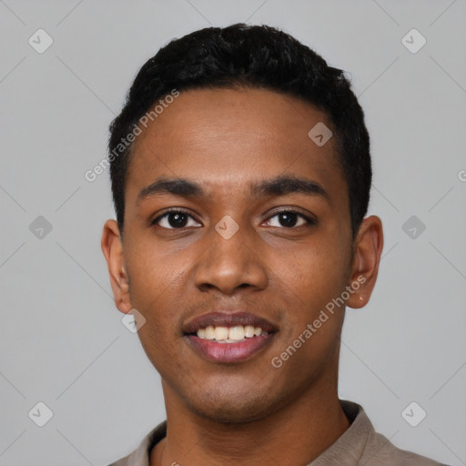 Joyful black young-adult male with short  black hair and brown eyes