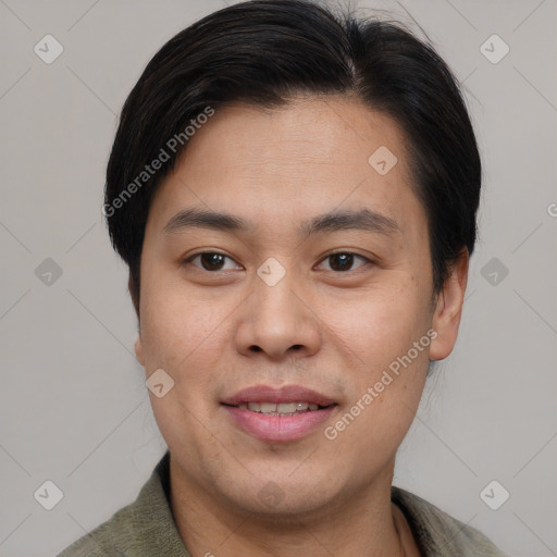 Joyful asian young-adult male with short  brown hair and brown eyes