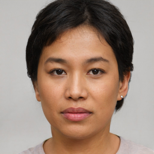 Neutral asian young-adult female with short  brown hair and brown eyes