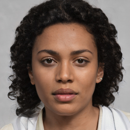 Neutral black young-adult female with medium  black hair and brown eyes