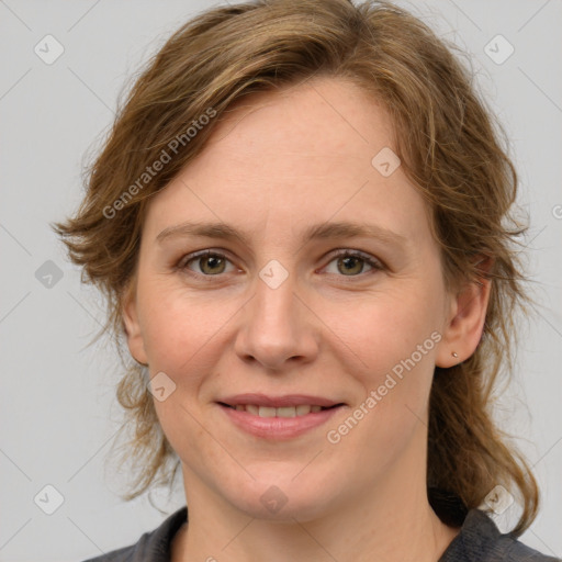 Joyful white young-adult female with medium  brown hair and green eyes