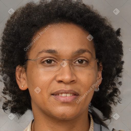 Joyful black adult female with short  brown hair and brown eyes
