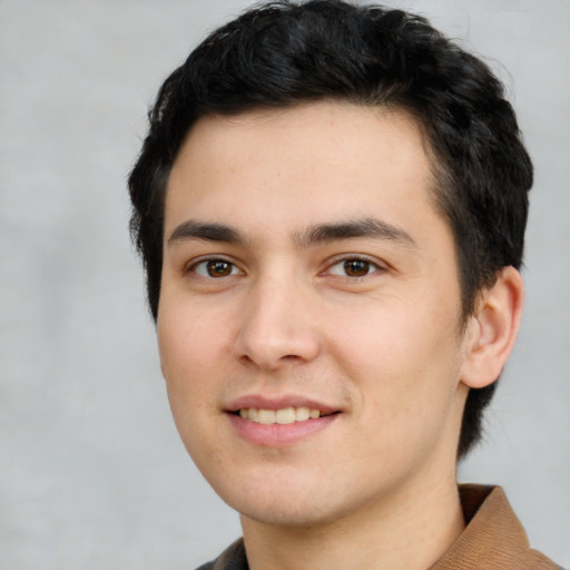 Joyful white young-adult male with short  black hair and brown eyes