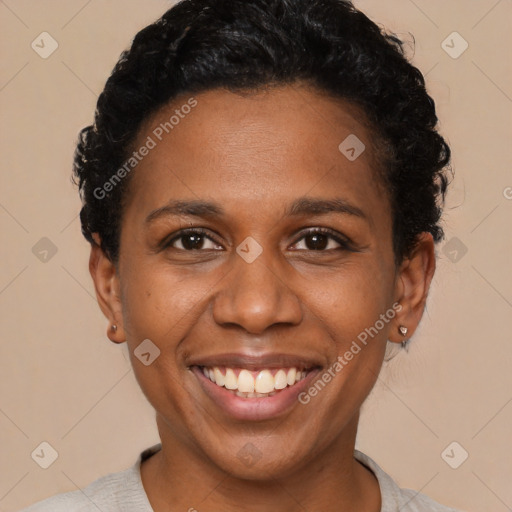 Joyful black young-adult female with short  black hair and brown eyes