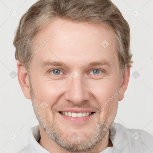 Joyful white adult male with short  brown hair and grey eyes