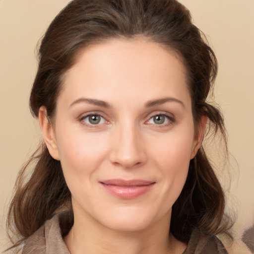 Joyful white young-adult female with medium  brown hair and brown eyes