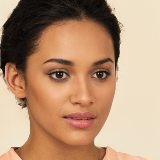 Joyful latino young-adult female with short  brown hair and brown eyes