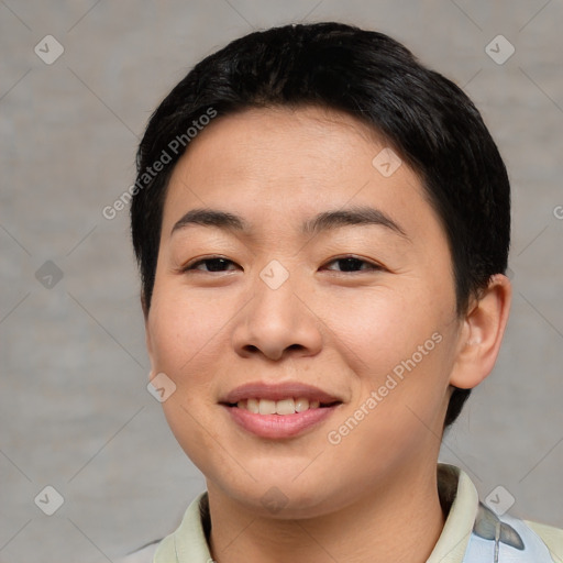 Joyful asian young-adult female with short  black hair and brown eyes