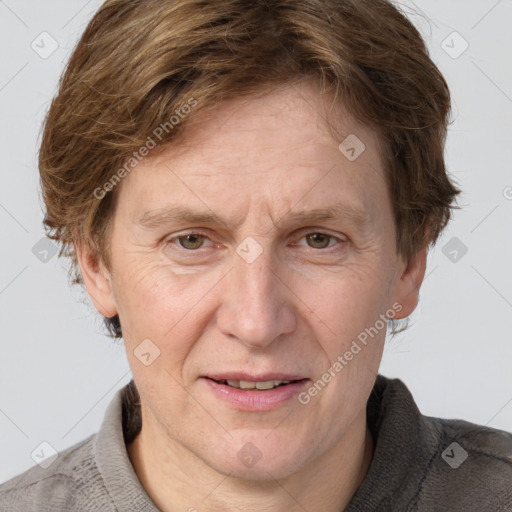 Joyful white adult male with short  brown hair and grey eyes