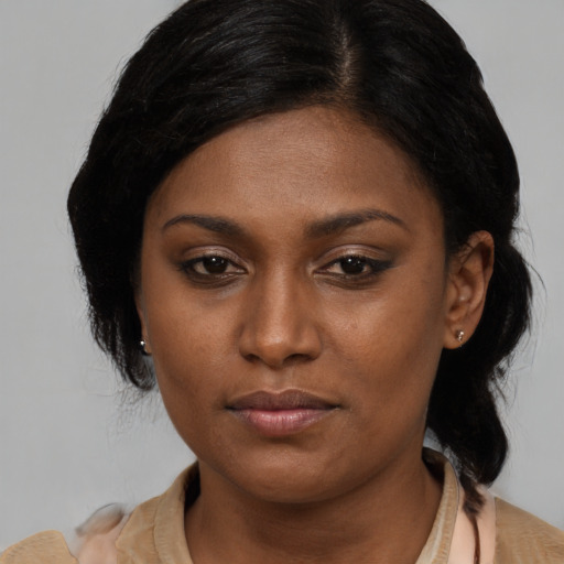 Neutral black young-adult female with medium  brown hair and brown eyes