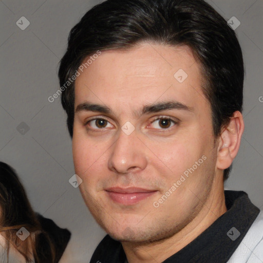 Joyful white adult male with short  brown hair and brown eyes