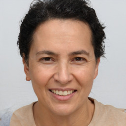 Joyful white adult female with short  brown hair and brown eyes