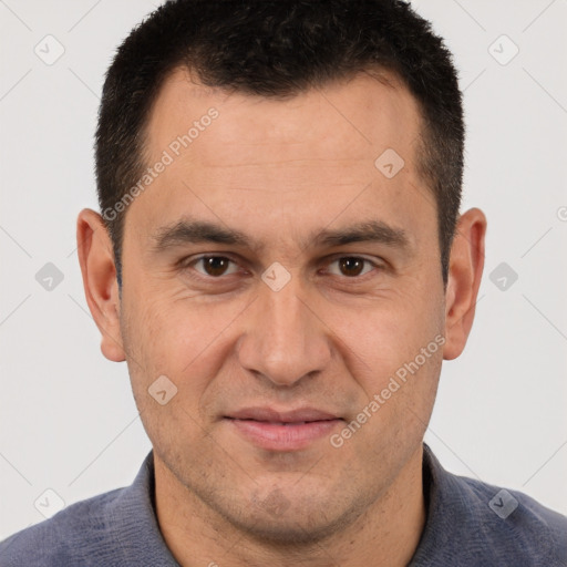 Joyful white adult male with short  brown hair and brown eyes