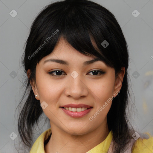 Joyful asian young-adult female with medium  black hair and brown eyes
