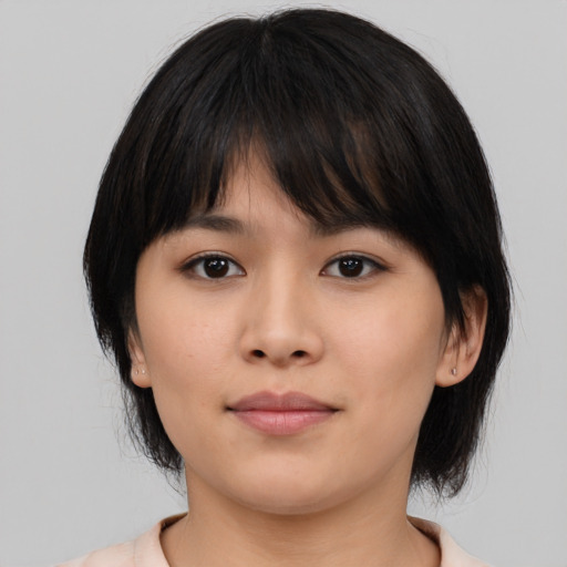 Neutral asian young-adult female with medium  brown hair and brown eyes