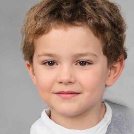 Joyful white child male with short  brown hair and brown eyes