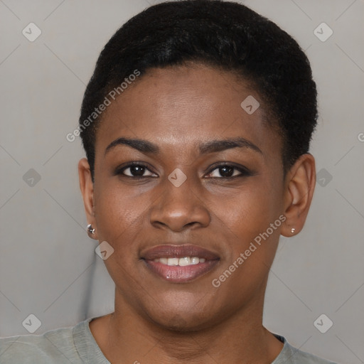 Joyful black young-adult female with short  black hair and brown eyes