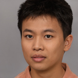 Neutral asian young-adult male with short  brown hair and brown eyes