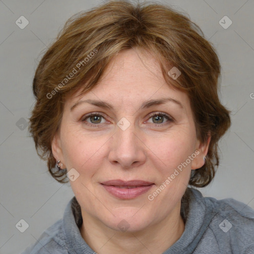 Joyful white adult female with medium  brown hair and grey eyes