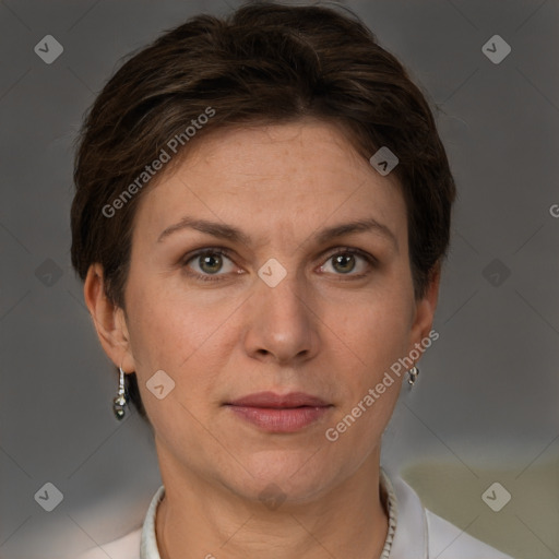 Joyful white adult female with short  brown hair and grey eyes