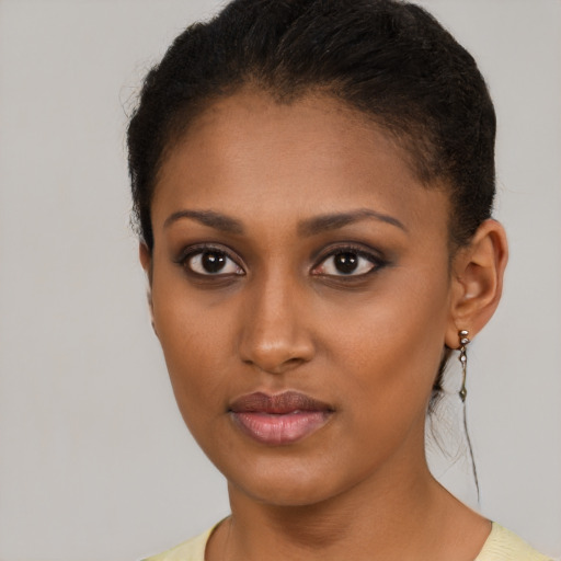 Neutral black young-adult female with short  brown hair and brown eyes