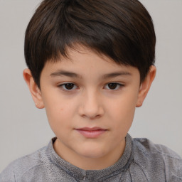 Joyful white child female with short  brown hair and brown eyes