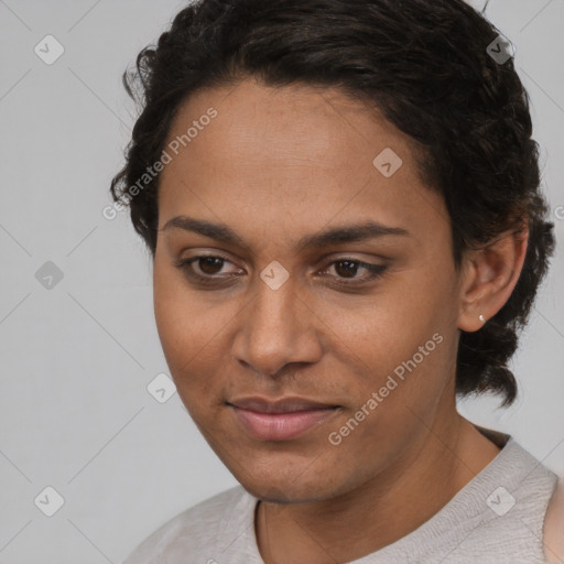 Joyful latino young-adult female with short  black hair and brown eyes