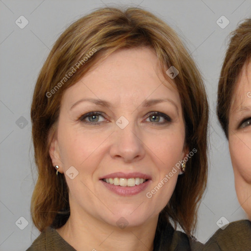 Joyful white adult female with medium  brown hair and brown eyes