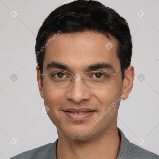 Joyful white young-adult male with short  black hair and brown eyes