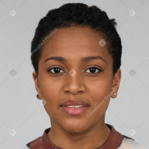 Joyful black young-adult female with short  black hair and brown eyes