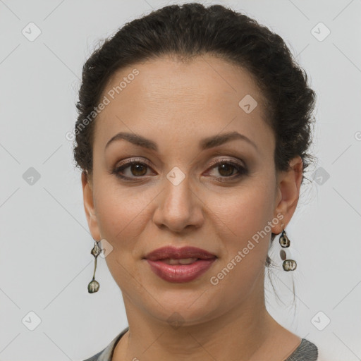 Joyful latino adult female with short  brown hair and brown eyes