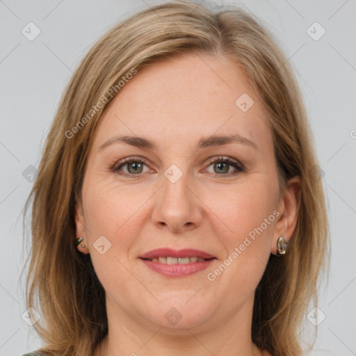 Joyful white adult female with medium  brown hair and grey eyes