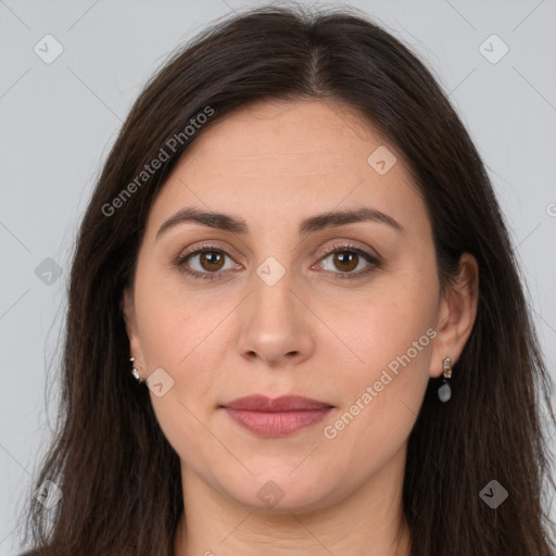 Joyful white adult female with long  brown hair and brown eyes