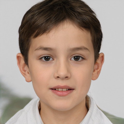 Joyful white child male with short  brown hair and brown eyes