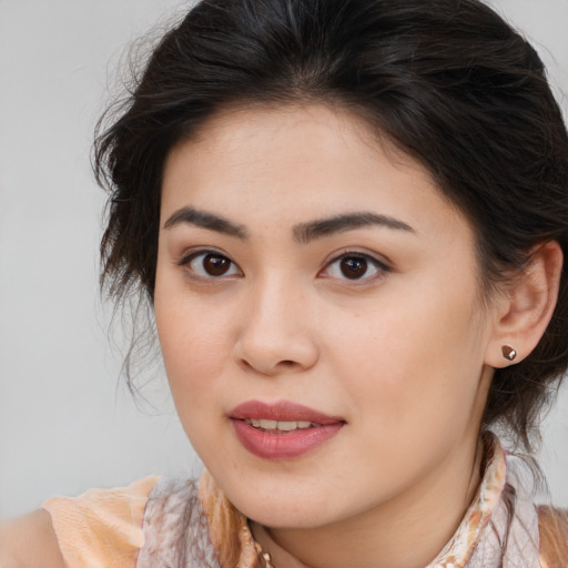 Joyful asian young-adult female with medium  brown hair and brown eyes