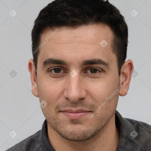 Joyful white young-adult male with short  brown hair and brown eyes