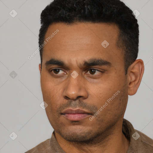 Neutral latino young-adult male with short  black hair and brown eyes